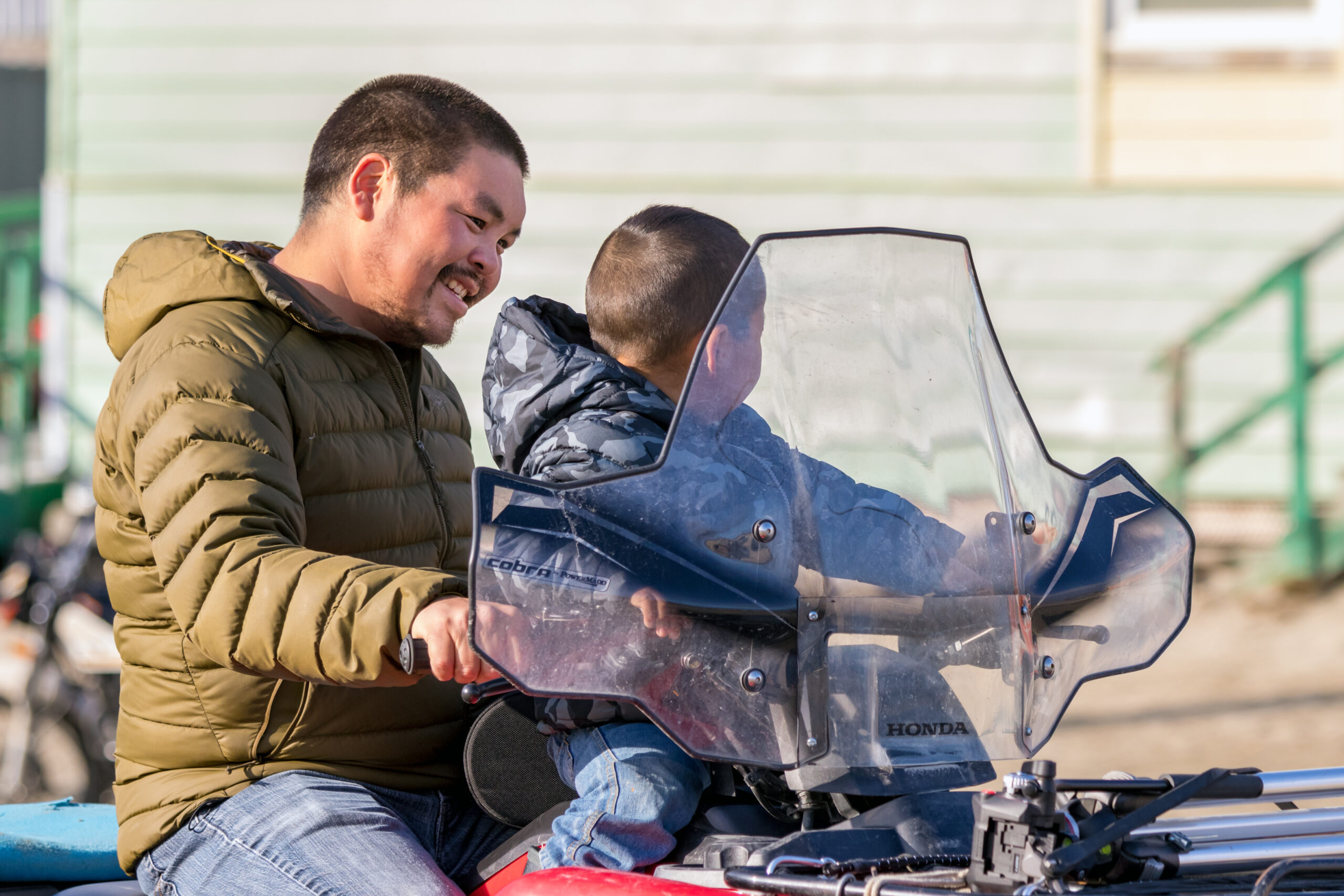 father and son on bike